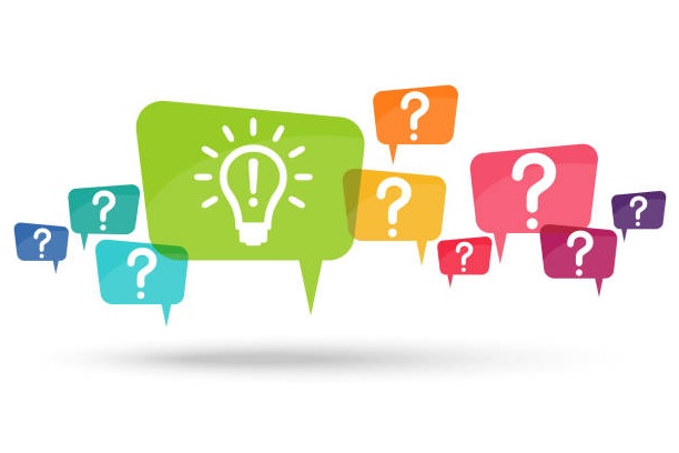 Bullets sitting next to a barrel of a pistol